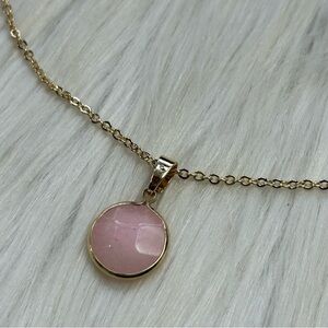 Rose quartz pendant gold tone necklace